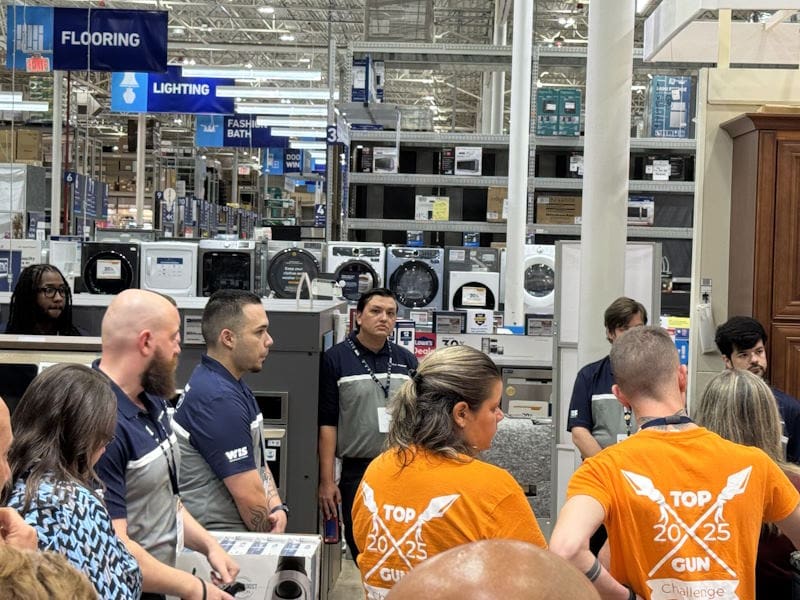 WIS employees standing in an appliance store 2