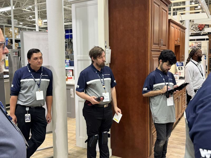 WIS employees standing and working in an appliance store