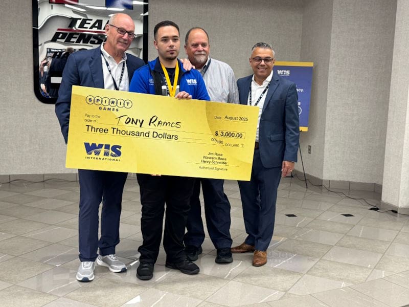 WIS employees standing with donation check 2