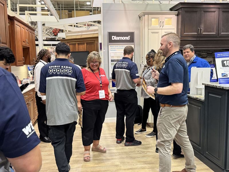 WIS employees smiling in appliance store